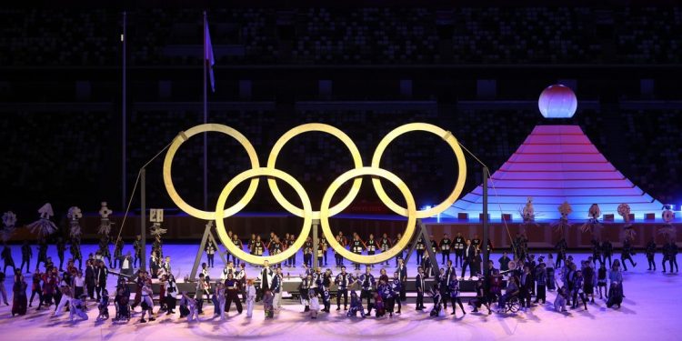 Tokyo Olympics began Friday with a scaled back celebratory opening ceremony